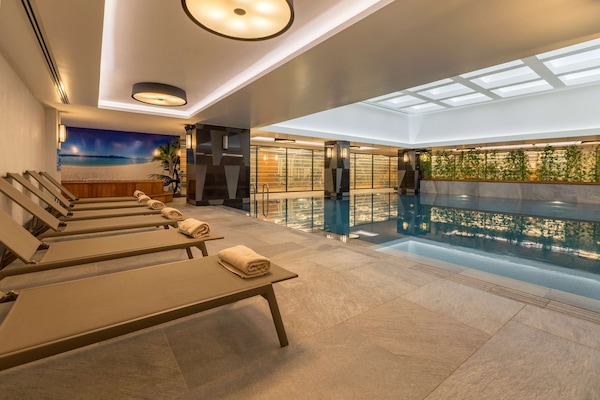 Indoor pool, open 7:00 AM to 10:00 PM, pool loungers