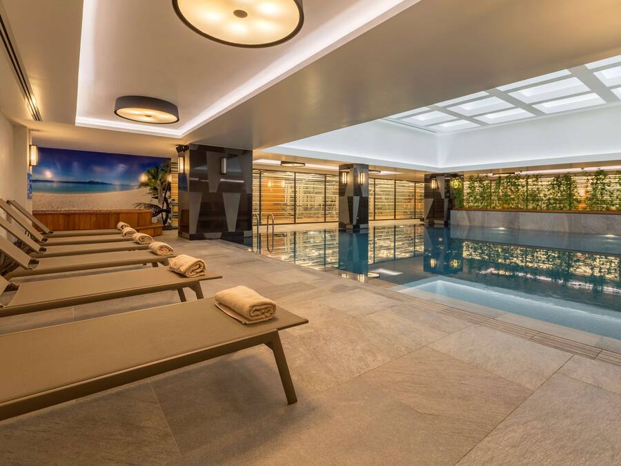 Indoor pool, open 7:00 AM to 10:00 PM, sun loungers