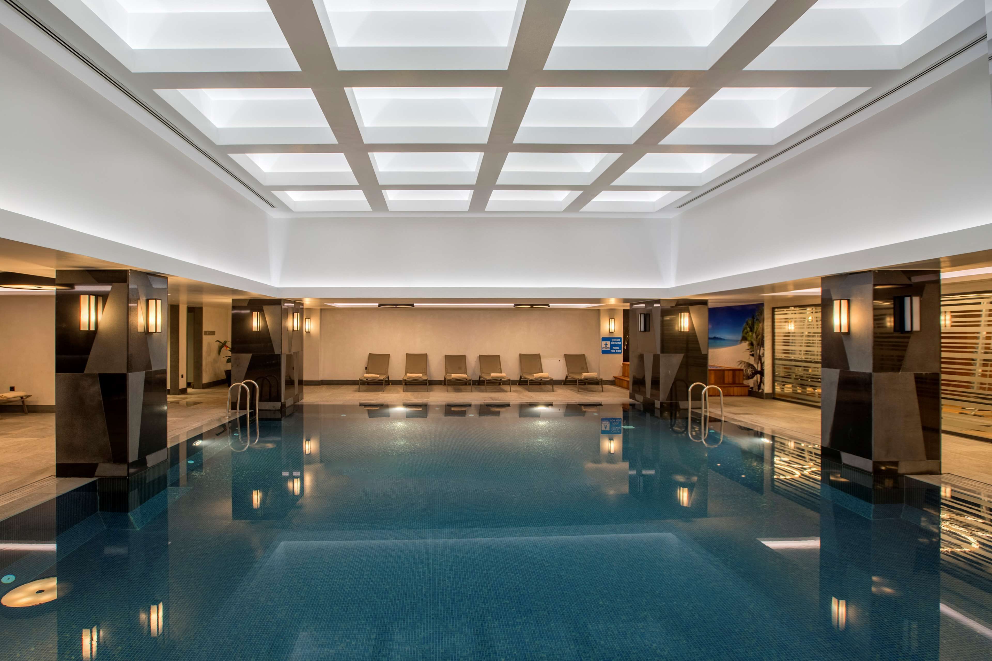 Indoor pool, open 7:00 AM to 10:00 PM, sun loungers