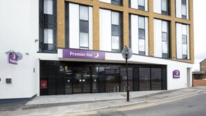 A Premier Inn hotel with a modern facade, large windows, and a prominent signage.