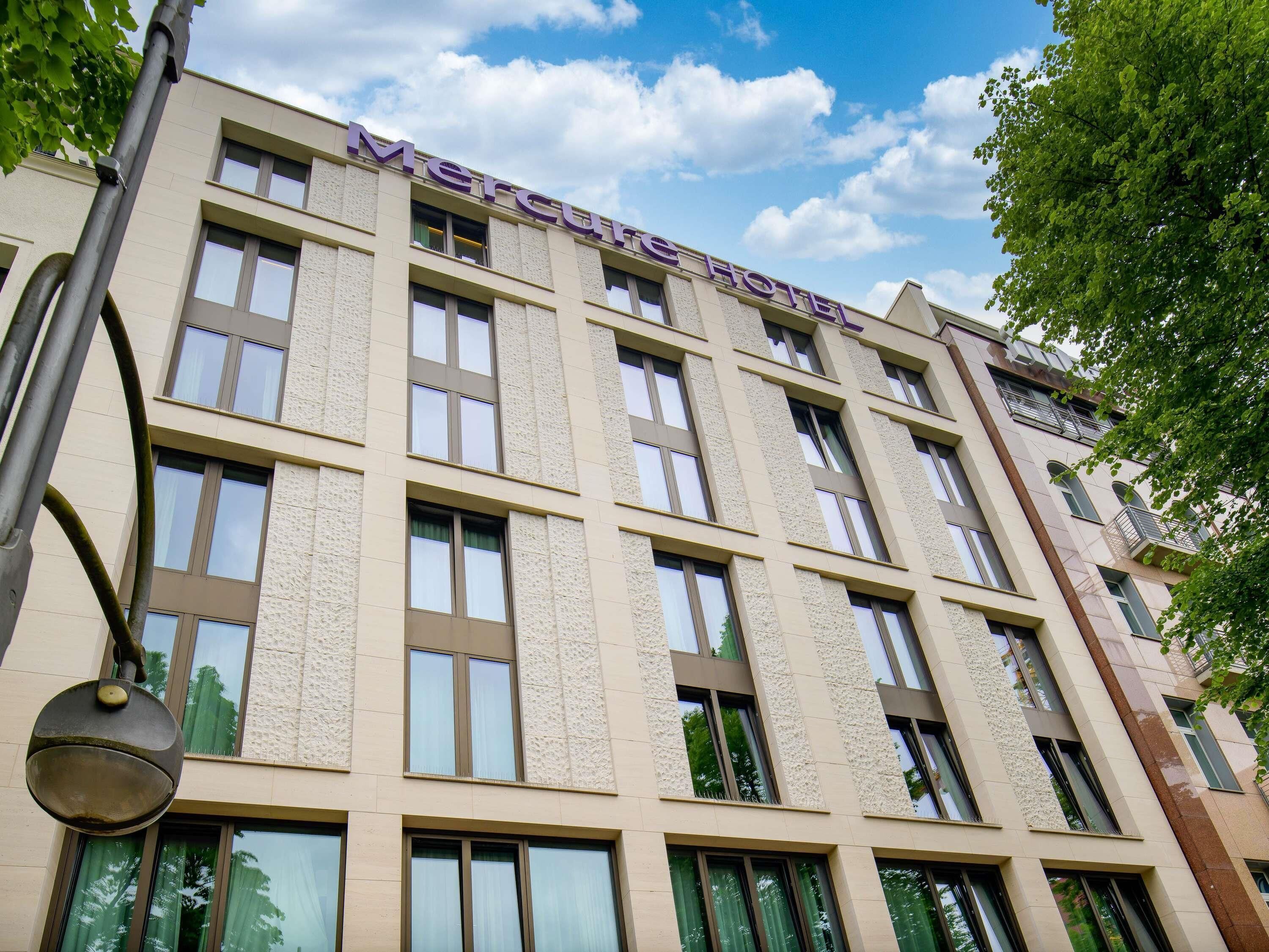 A multi-story building with the name "Mercure Hotel" on the facade.