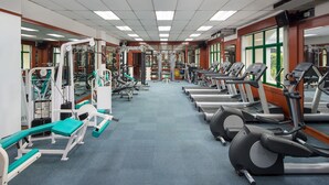 A gym with various exercise equipment, including treadmills and weight machines, arranged in rows. - Mercure Yangon Kaba Aye (Yangon)