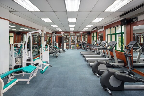 A gym with various exercise equipment, including treadmills and weight machines, arranged in rows. - Mercure Yangon Kaba Aye (Yangon)