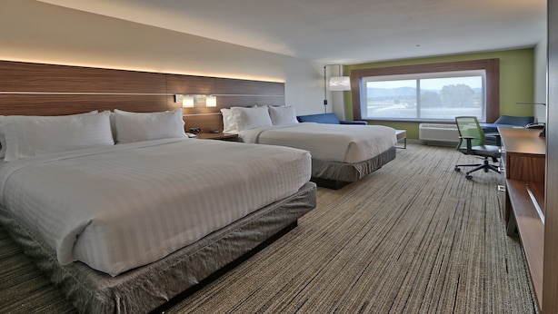 A hotel room with two beds, a desk, a chair, and a large window. - Holiday Inn Express and Suites Broomfield by IHG (Broomfield)
