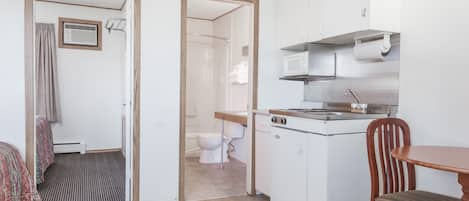 Triple Room, Smoking, Kitchenette | 1 bedroom, desk, iron/ironing board, free WiFi