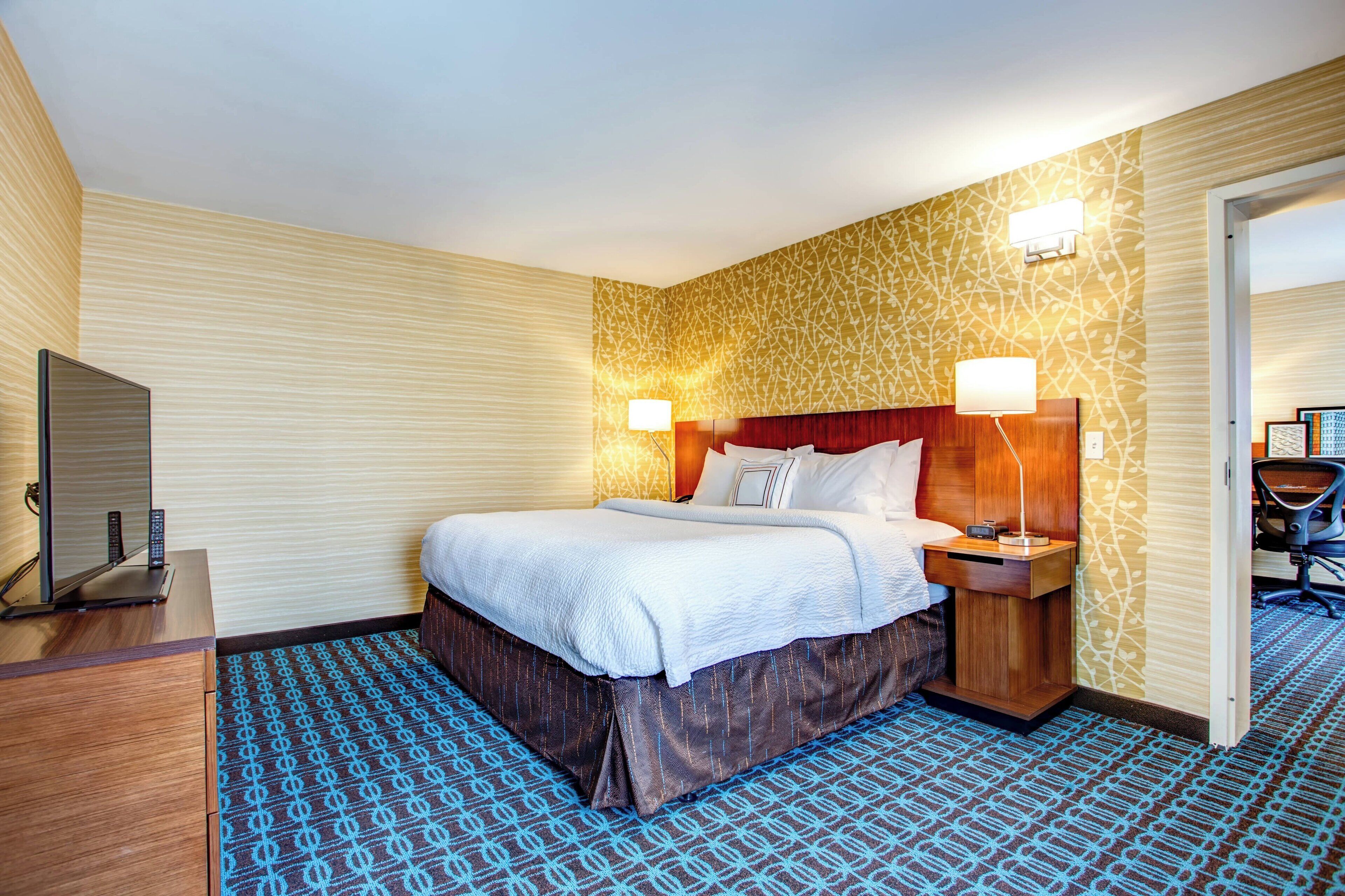 pillow-top beds, desk, laptop workspace, blackout curtains