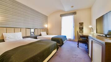 Economy Twin Room | Desk, laptop workspace, blackout drapes, free WiFi