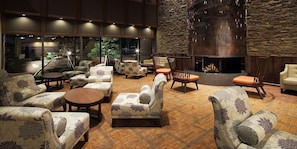 A lounge area with sofas, armchairs, and a fireplace. - Hakodate Hotel Banso(ORIX HOTELS & RESORTS) (Hakodate)