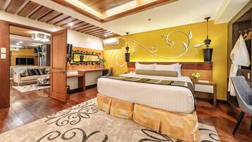 A modern bedroom with a large bed, wooden ceiling, and a decorative wall mural.