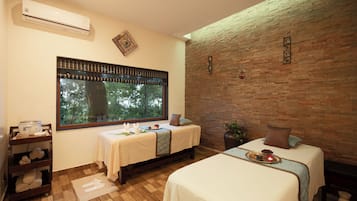 Enjoy a comfortable stay in this well-appointed room with two beds, a table, and amenities for a relaxing getaway.