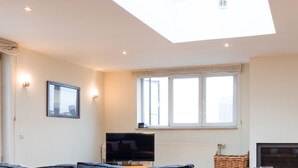 Deluxe Apartment, 3 Bedrooms, 2 Bathrooms | Living area | Flat-screen TV