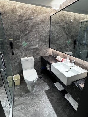 Shower, free toiletries, slippers, towels