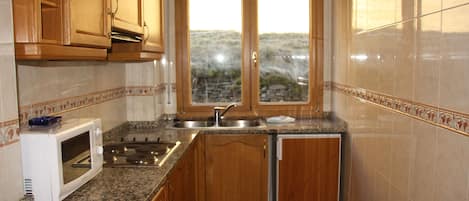 Apartment, 1 Bedroom (4 people) | Private kitchen | Full-size fridge, microwave, stovetop, coffee/tea maker