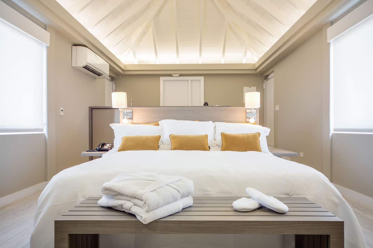 Junior King Suite with Private Solarium Pool View and Partial Ocean View