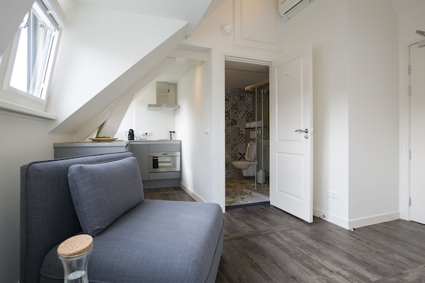 Comfort Loft (4th Floor, Accessible by stairs only) | In-room safe, desk, blackout drapes, soundproofing