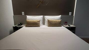 Standard Double Room | Minibar, in-room safe, desk, blackout drapes