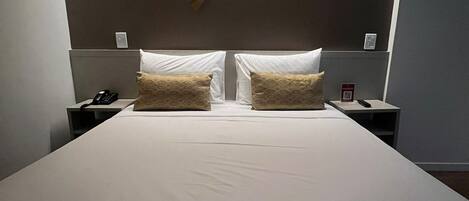 Standard Double Room | Minibar, in-room safe, desk, blackout drapes