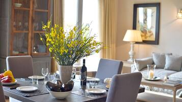 Classic Apartment, 2 Bedrooms | Living area | Flat-screen TV