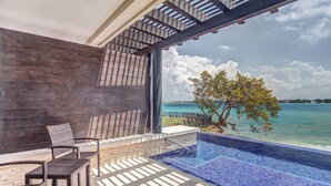 A modern outdoor area with a pool, seating, and a view of the sea. - Royalton Hideaway Negril, An Autograph Collection® All-Inclusive Resort - Adults Only (Negril)
