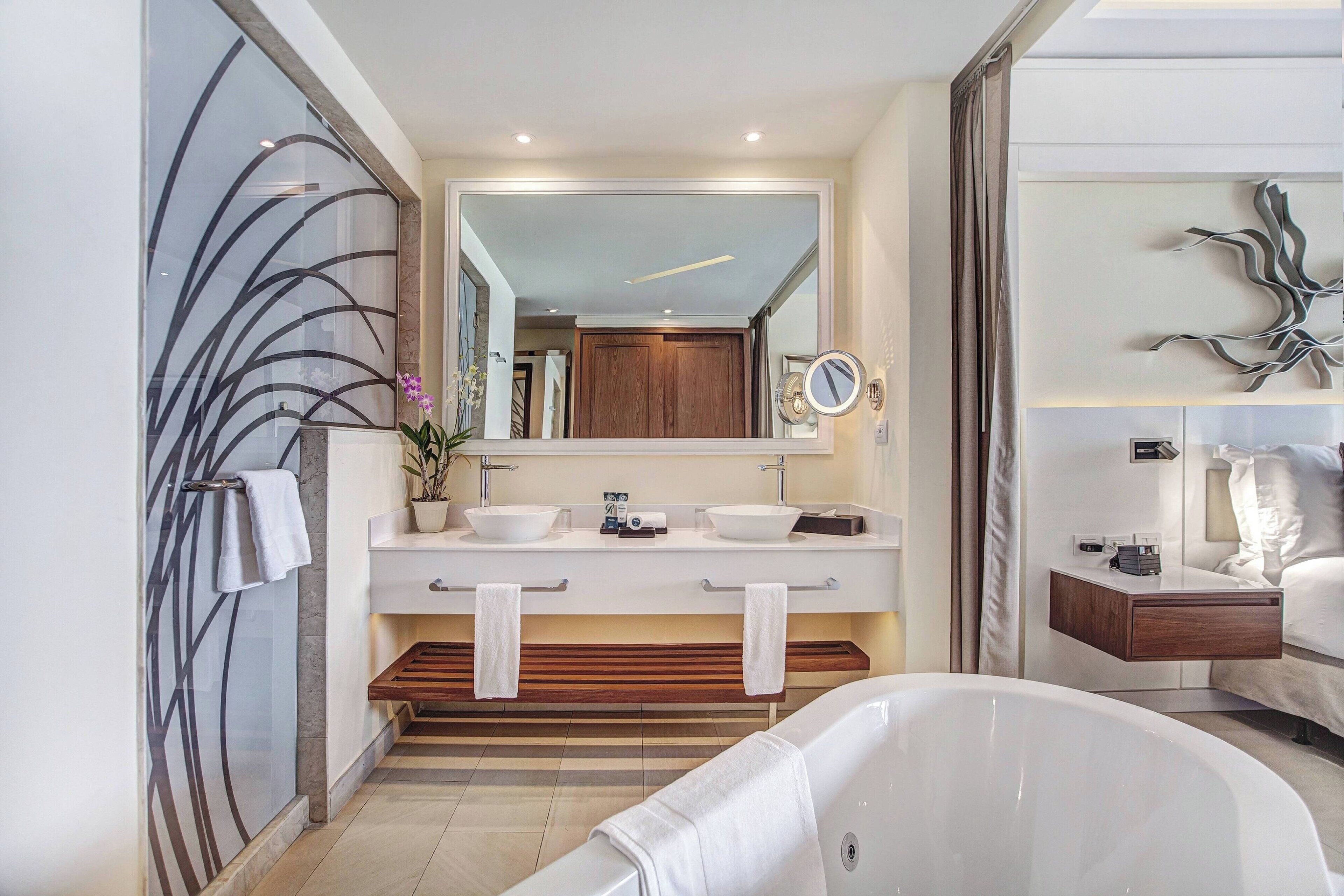 Separate tub and shower, deep soaking tub, free toiletries, towels