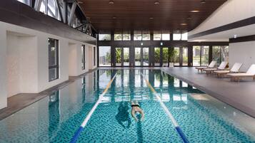 Indoor pool, open 7:00 AM to 10:00 PM, pool loungers, lifeguards on site