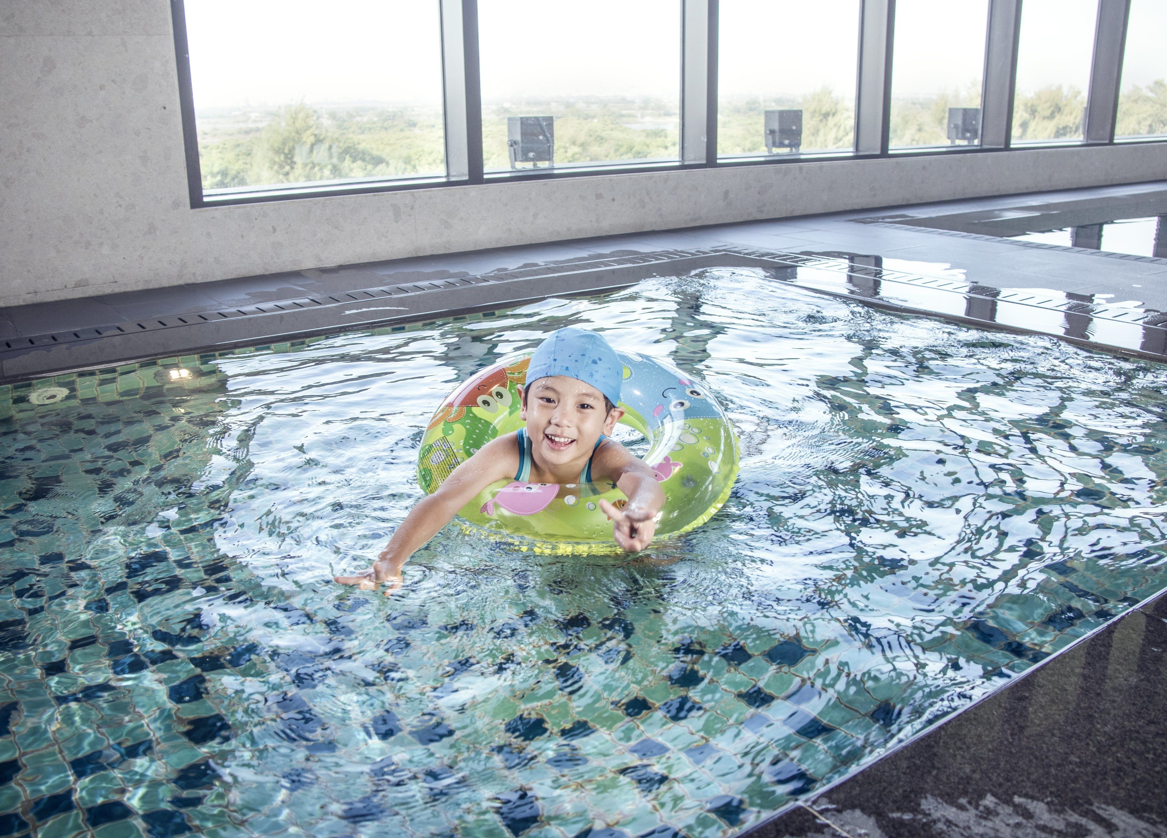 Indoor pool, open 7:00 AM to 10:00 PM, pool loungers, lifeguards on site