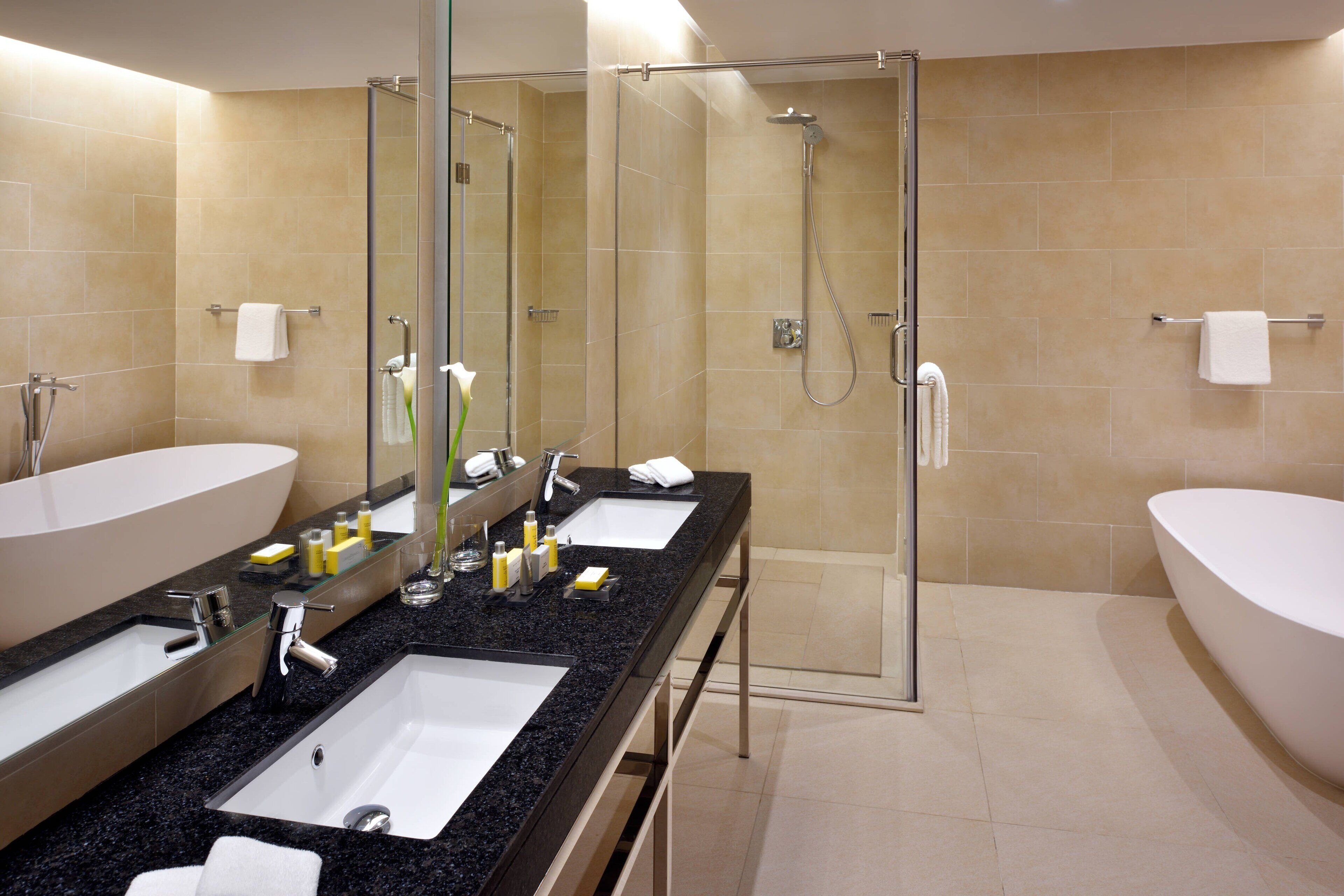 executive suite, 1 bedroom, non smoking | bathroom | combined shower/bathtub, designer toiletries, hair dryer, bathrobes