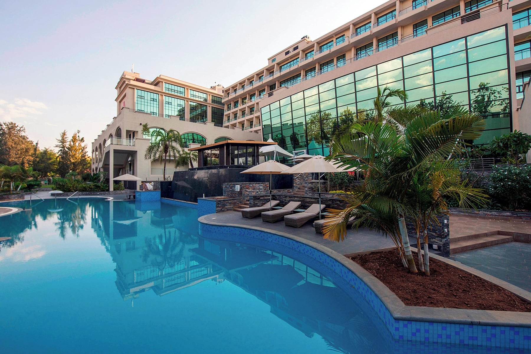 Outdoor pool, open 6:00 AM to 7:00 PM, pool umbrellas, sun loungers