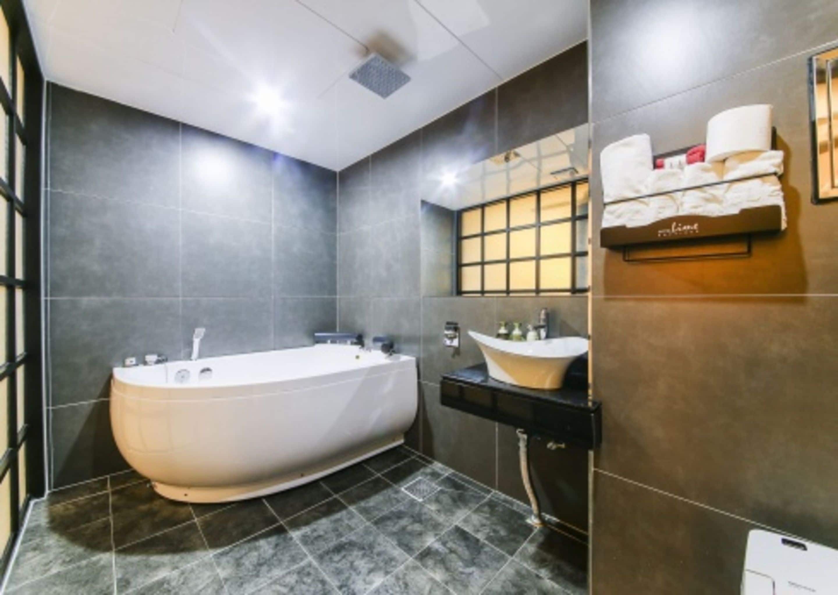 suite (massage chair) | bathroom | shower, free toiletries, hair dryer, bathrobes