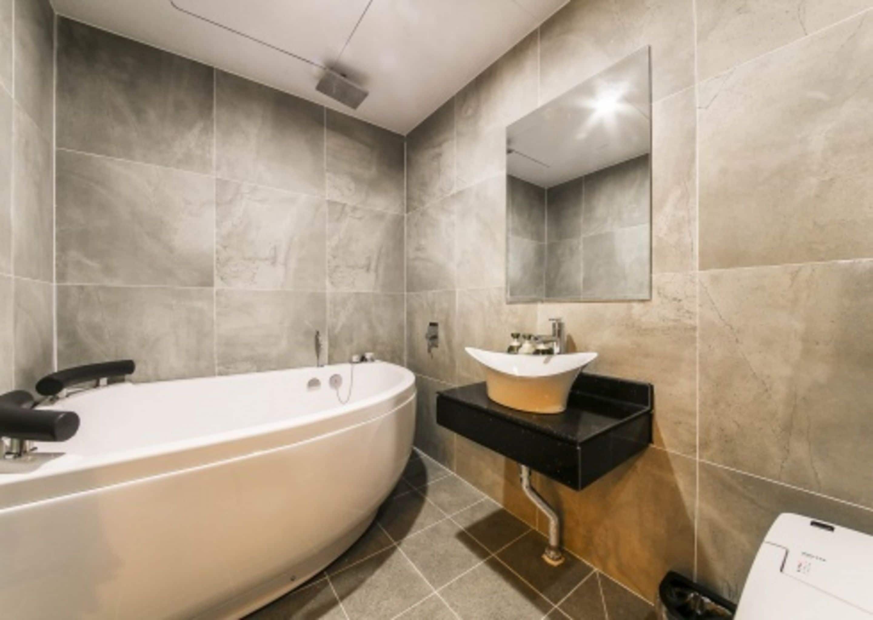 premium room | bathroom | shower, free toiletries, hair dryer, bathrobes