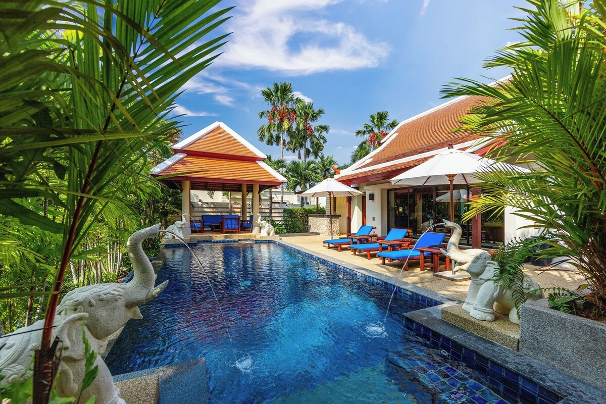 A swimming pool with lounge chairs and a gazebo.