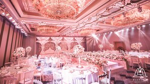 A banquet hall with round tables, white chairs, and floral centerpieces. - Evergreen Laurel Hotel Shanghai (Shanghai)