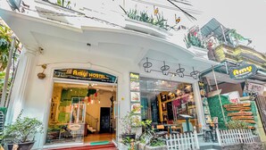 A hostel with a sign reading "Amy Hostel" and a visible staircase leading to the entrance. - Amy Hostel Hue (Hue)