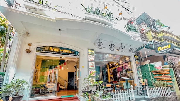 A hostel with a sign reading "Amy Hostel" and a visible staircase leading to the entrance. - Amy Hostel Hue (Hue)