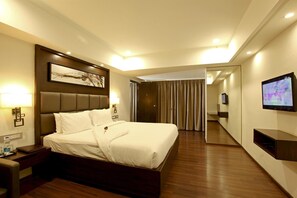 Luxe beddengoed, een minibar, een kluis op de kamer, een bureau