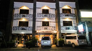 A building with a sign reading "Roxas President's Inn". It has multiple balconies with decorative railings. - Roxas President's Inn (Roxas City)