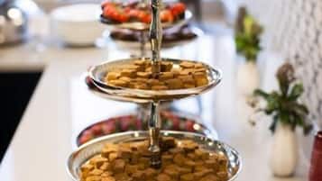 A tiered serving tray with various food items, likely for a buffet or catering event.