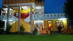 A multi-story building with a distinctive architectural style, featuring a central staircase and a balcony. - Villa Ceylon (Kimbulapitiya- Katunayake)