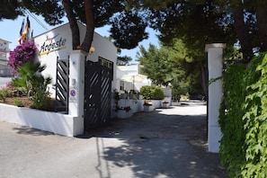 A gated entrance to a building with a sign reading "Argeste." - Argeste Club Vacanze (Vieste)