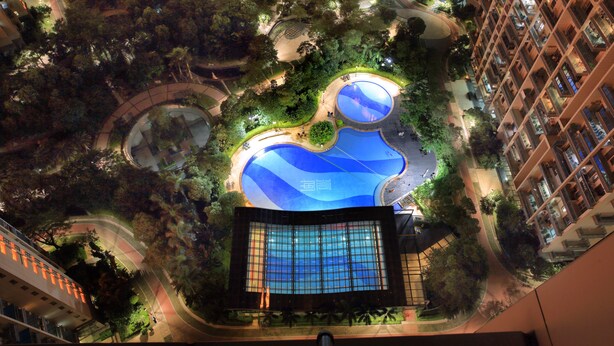 An aerial view of a modern building with a rooftop garden, a swimming pool, and a large glass facade. - Hisoar Hotel Shenzhen (Shenzhen)