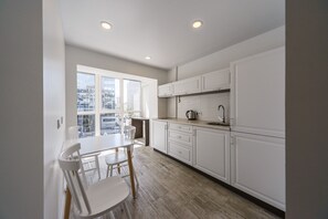 Panoramic Apartment, 1 Bedroom, Kitchen | Private kitchen | Fridge, microwave, coffee/tea maker, electric kettle - Partner Guest House (Kyiv)