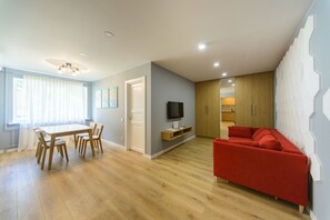 Executive Apartment, 1 Bedroom, Courtyard Area | Living room | Flat-screen TV - Partner Guest House (Kyiv)