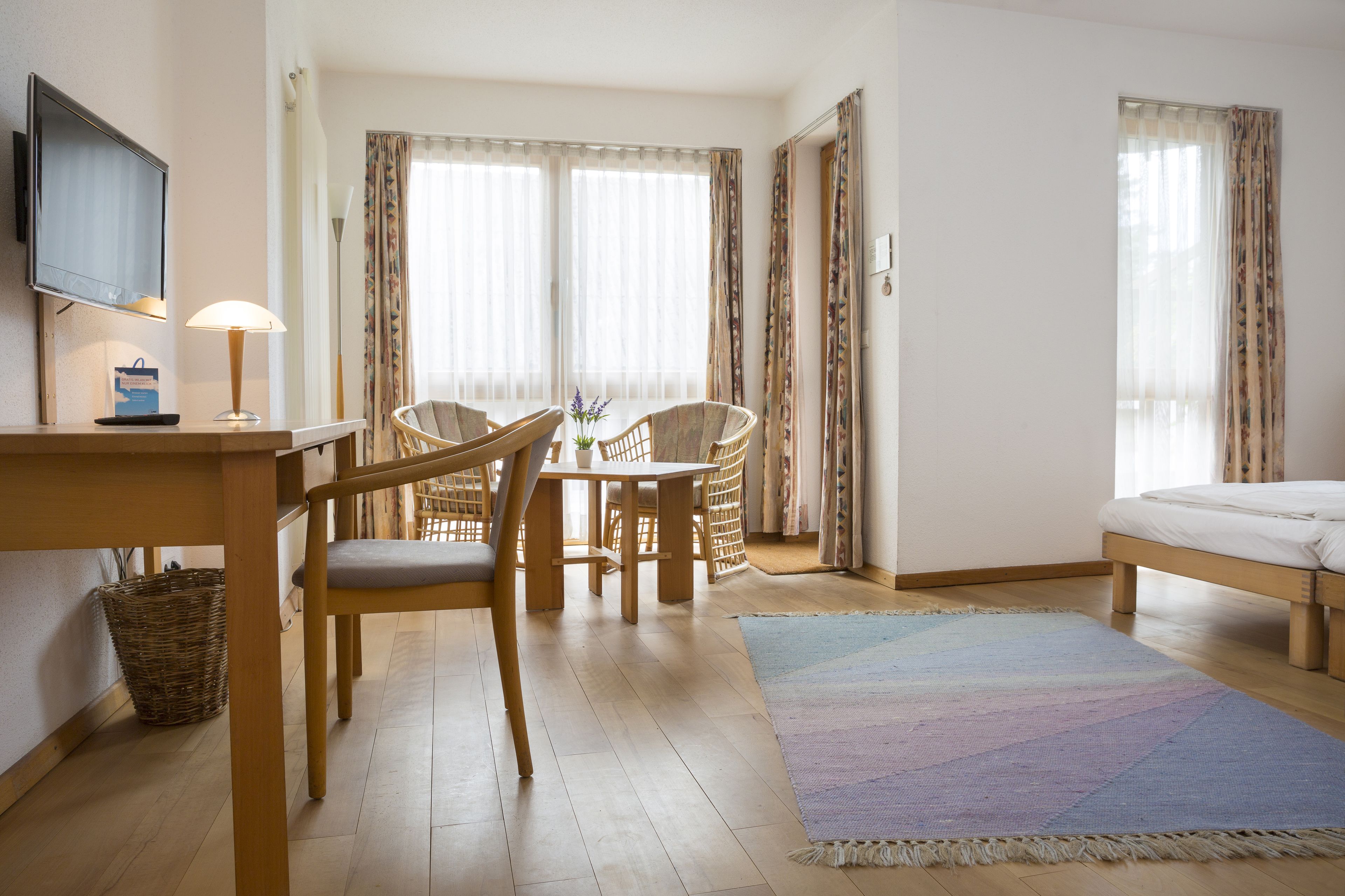 standard double room | living area | flat-screen tv