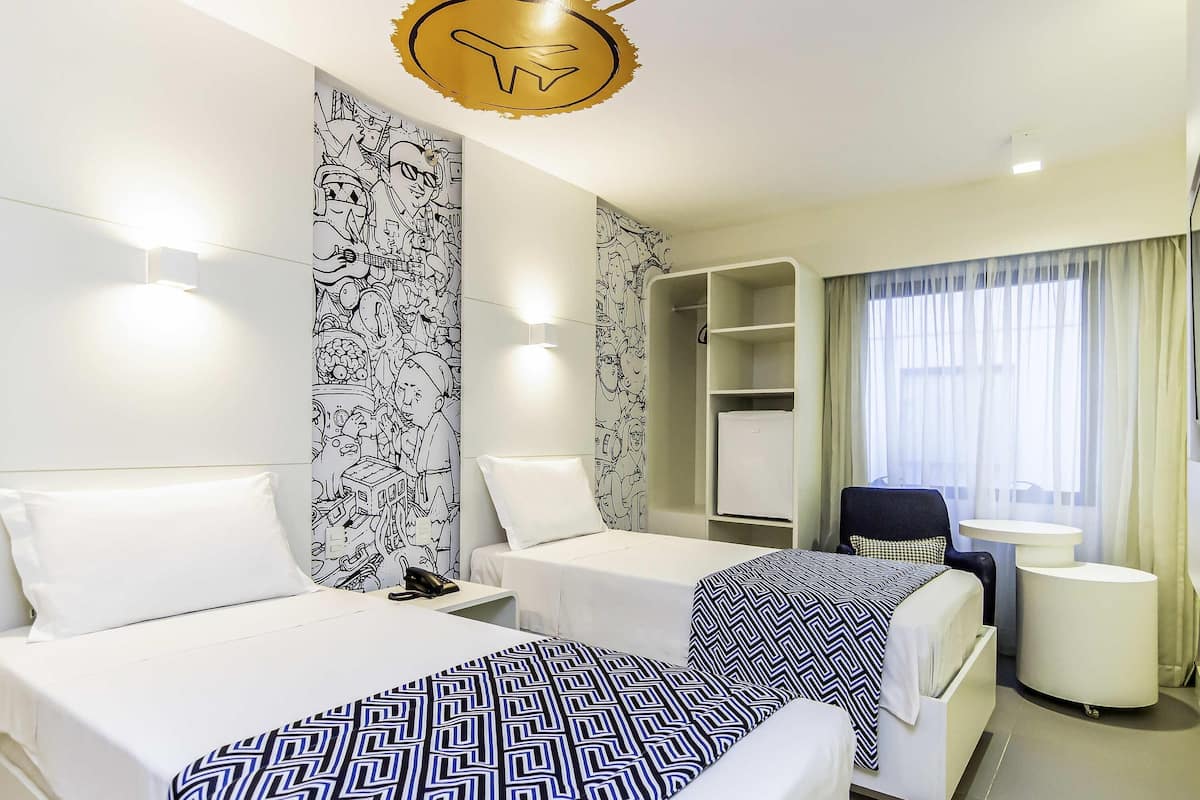 Standard Apartment, 2 Twin Beds | Minibar, in-room safe, desk, blackout drapes