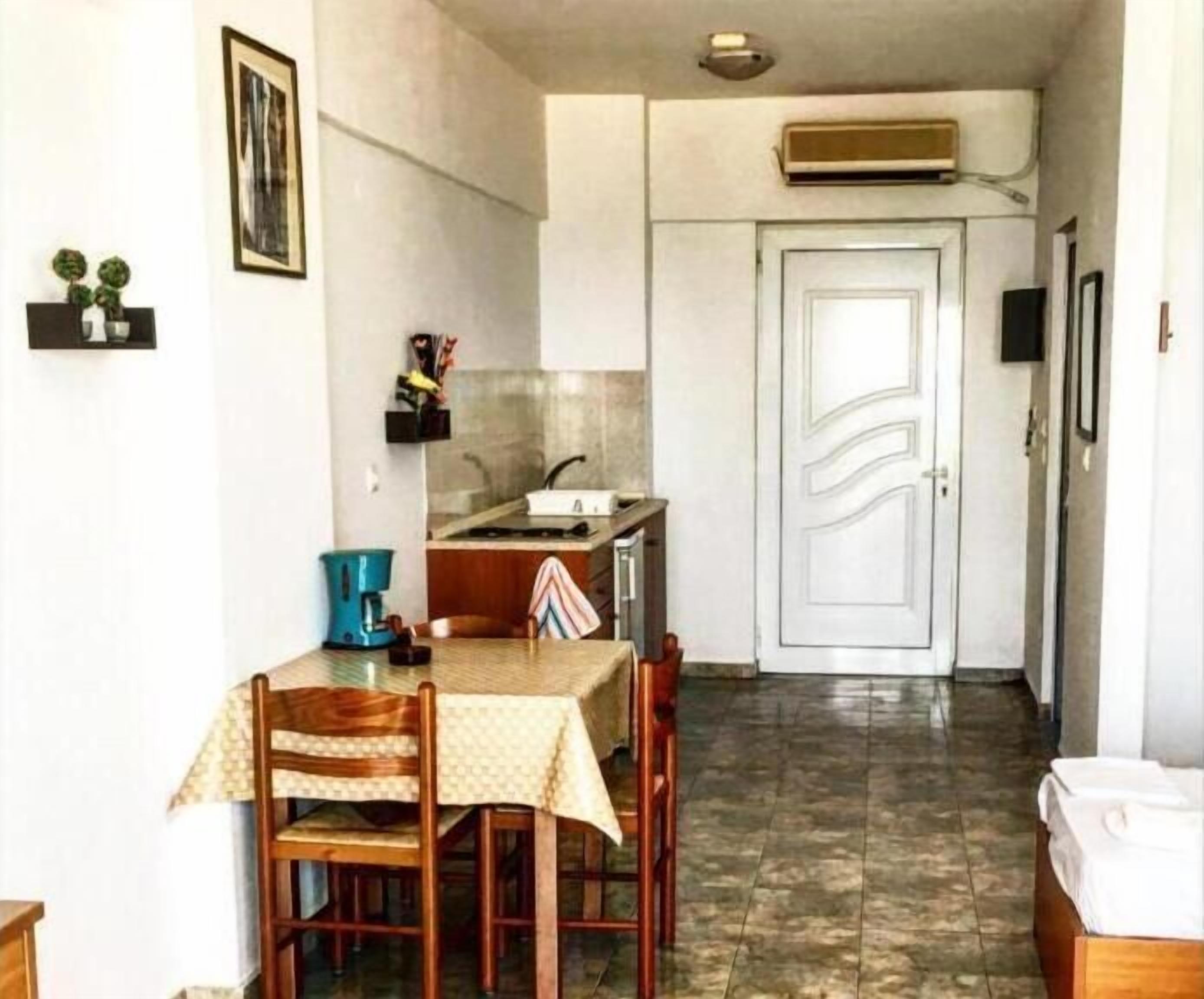 fridge, stovetop, electric kettle, cookware/dishes/utensils