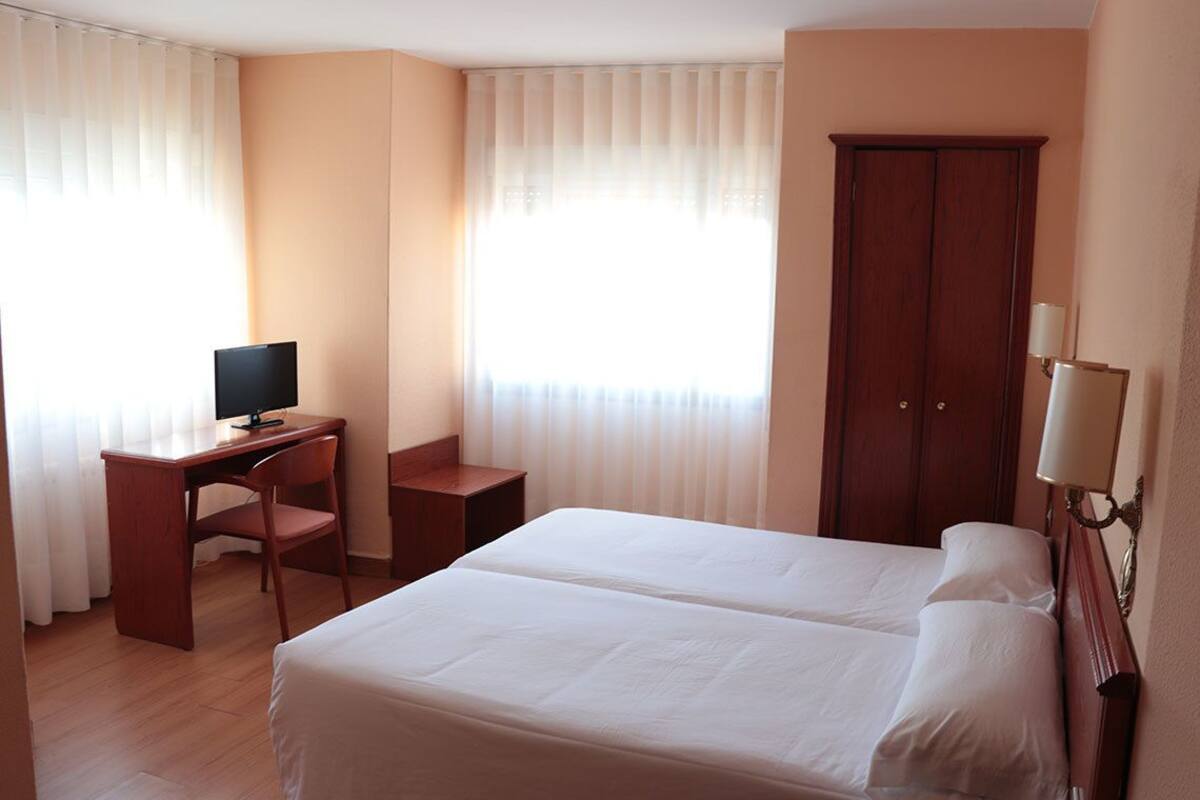 Desk, blackout curtains, free cots/infant beds, rollaway beds