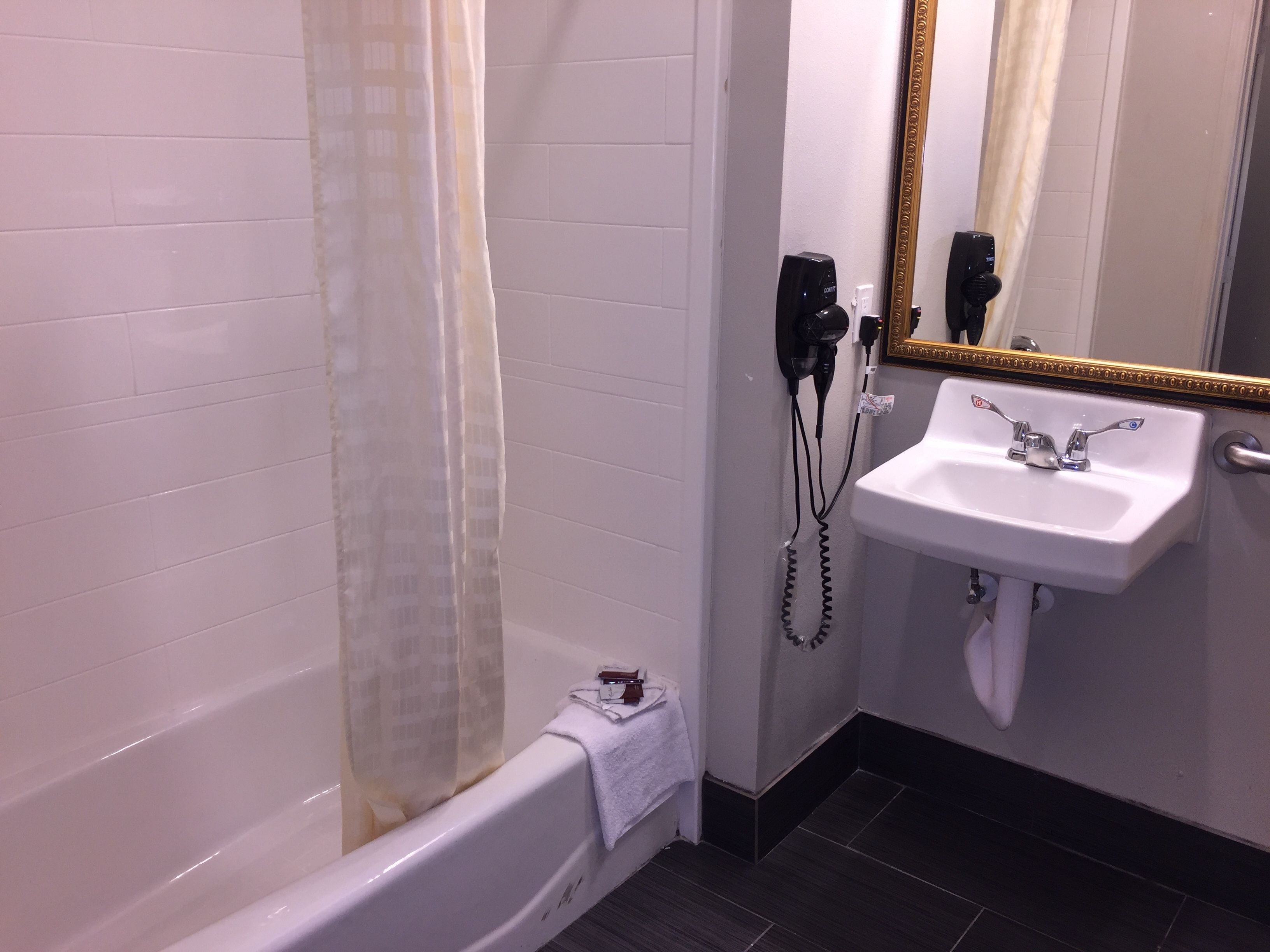 queen room with 2 queen beds | bathroom | combined shower/bathtub, free toiletries, towels