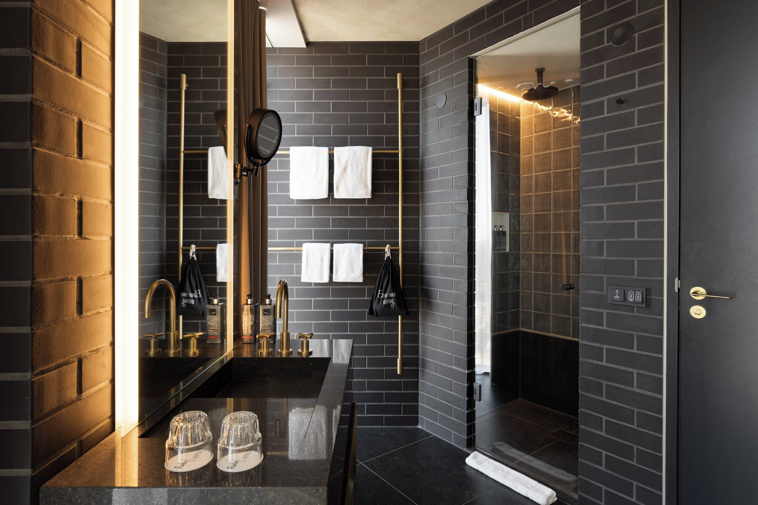 Designer toiletries, hair dryer, towels
