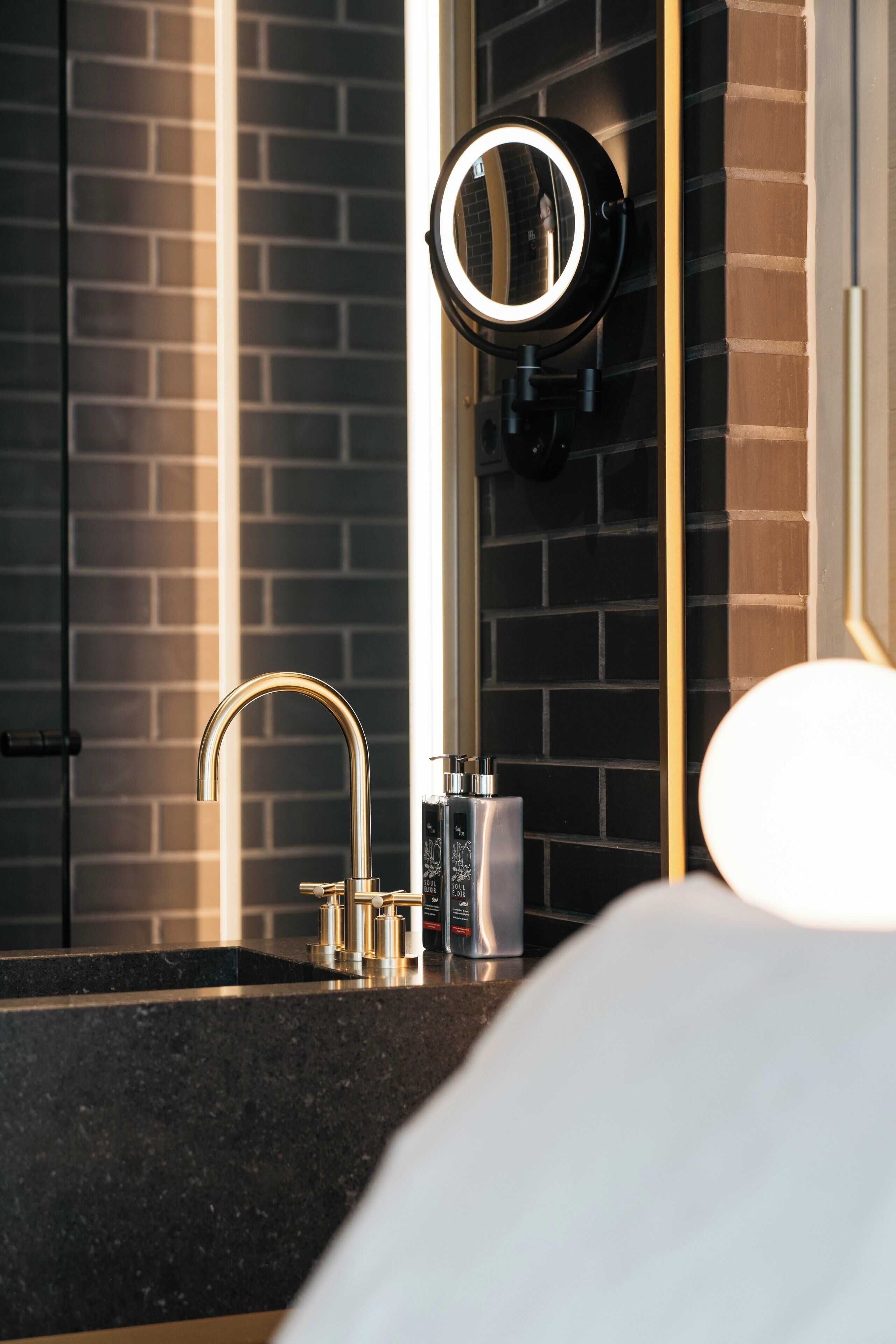 designer toiletries, hair dryer, towels