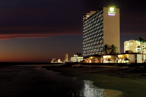A multi-story hotel with a prominent sign for 'Holiday Inn Resort' at the top. - Holiday Inn Resort Mazatlan by IHG (Mazatlán)